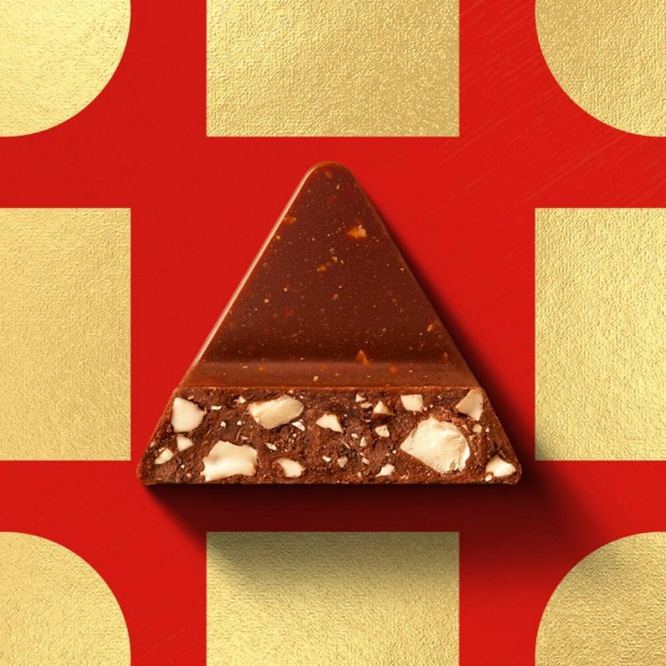 toblerone triangle on a red/golden background